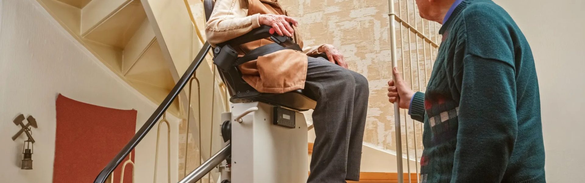 Curved staircase stairlift in use